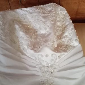 It’s a brand new wedding dress and it comes with a veil and other things